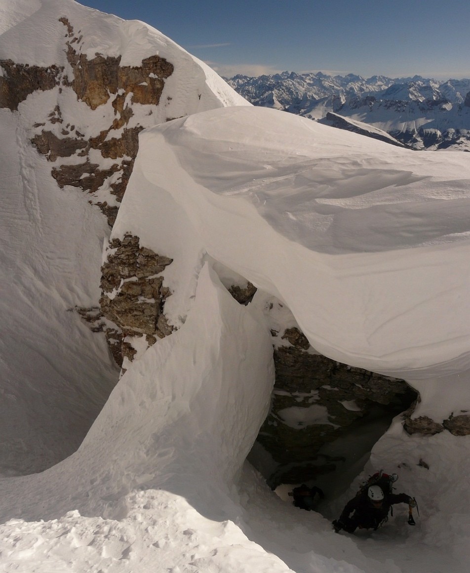 Crossing of a small natural arch under a big cornice