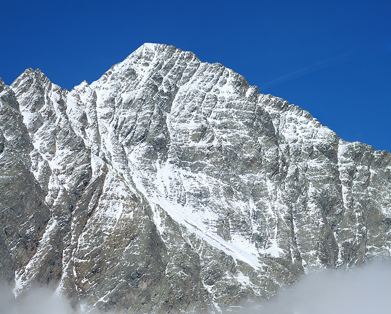 Immagine ravvicinata di 6 foto con il teleobiettivo del versante S del Piz Linard 3411 m visto dal Piz Glims 2868 m.
