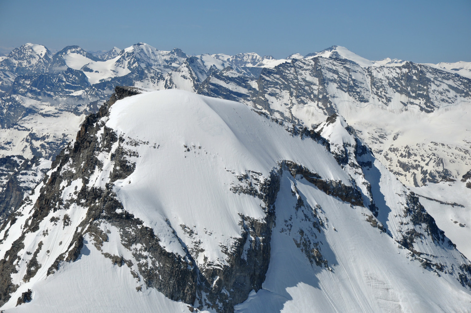 Ciarforon (3641m) : north face. Three climbers on the final snow slope