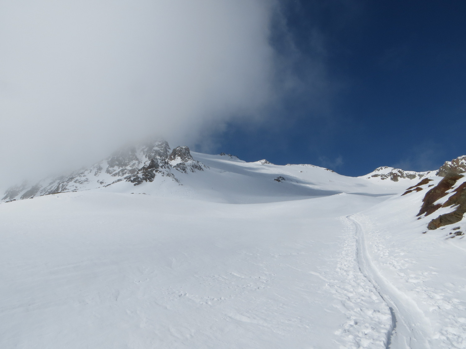 Start of the Hauslab glacier, summit in the clouds
