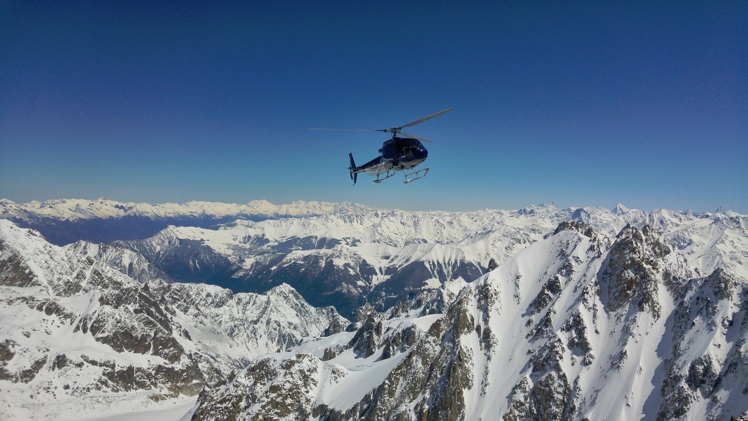 Apparently heli skiing helicopter from Switzerland dropping people directly at the ridge above the Col du Tour Noir..