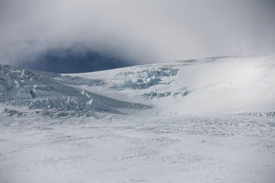 the summit section with visible blue ice and serac to cross